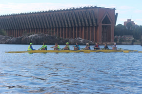 Upper Peninsula Community Rowing Club (UPCRC) rowing in Marquette's Lower Harbor